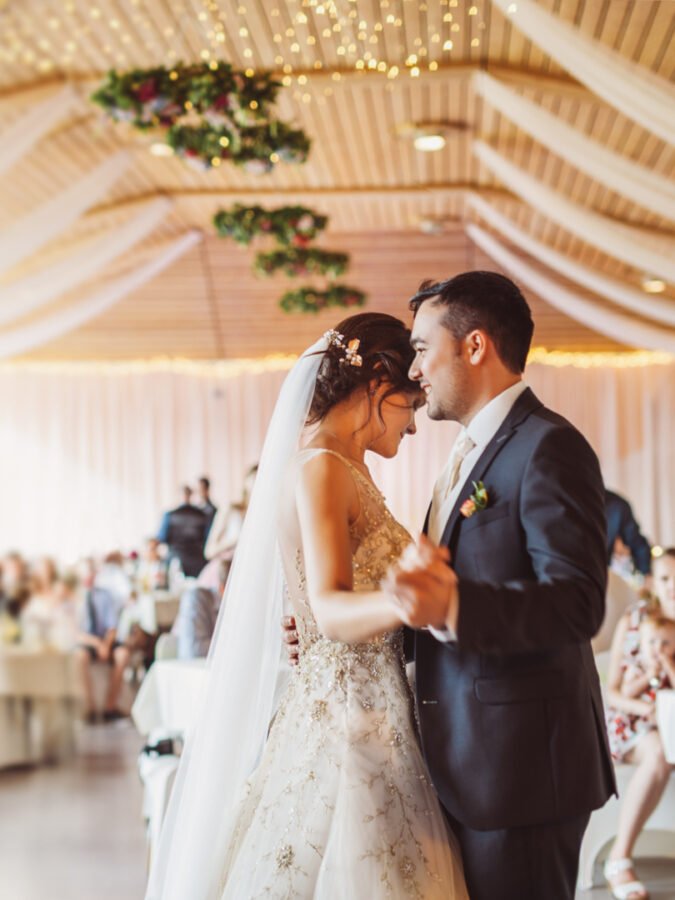 Happy just married young couple at the first wedding dance